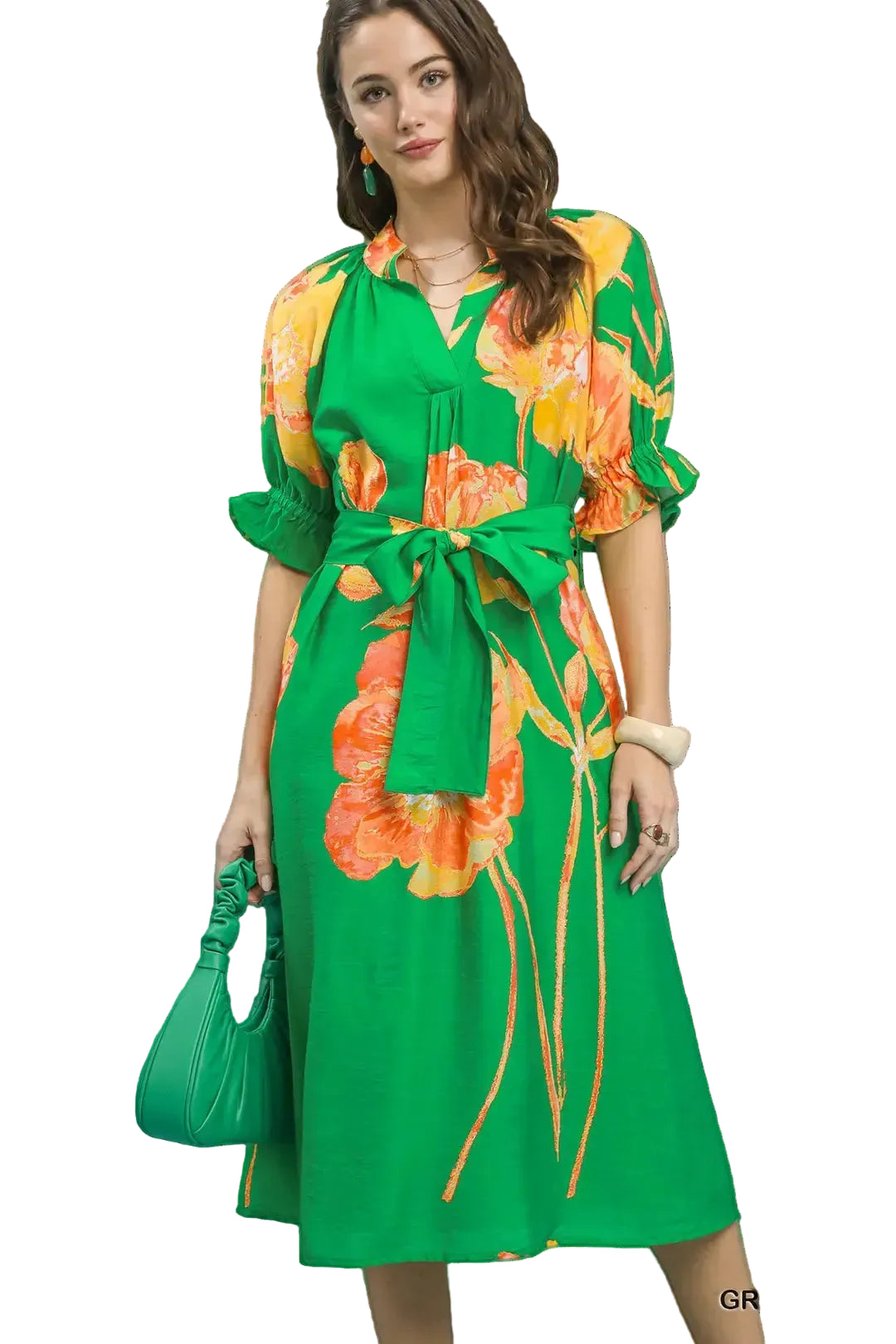 Woman wearing a green floral dress with a Umsgee Exclusive logo on a light blue background